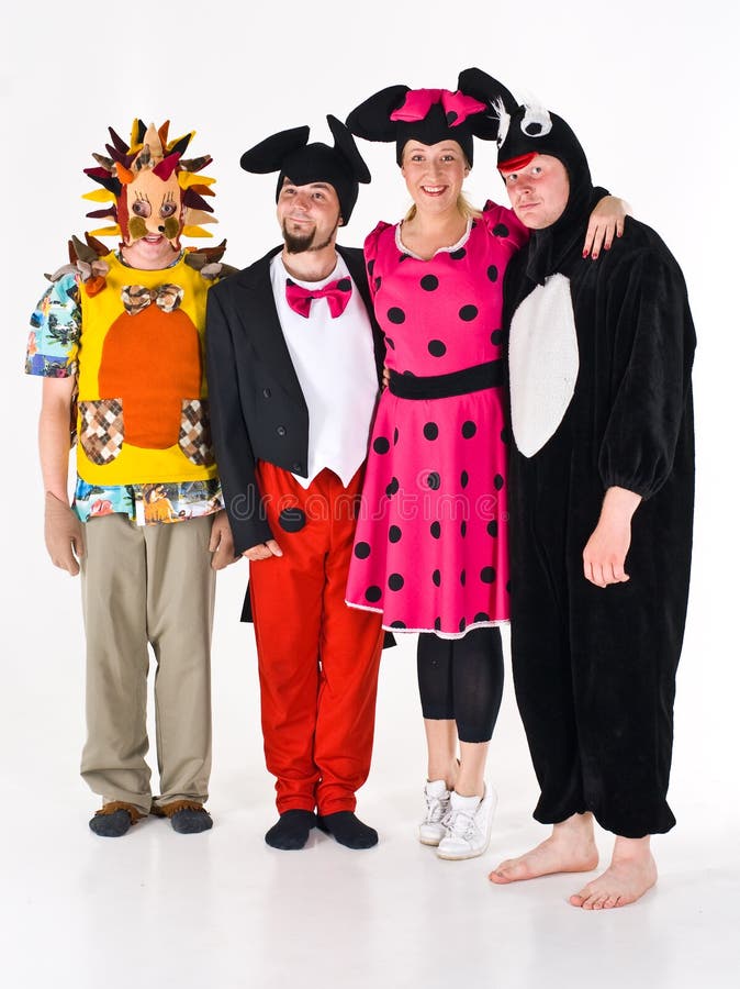 A group of adults in costumes for theater. A group of adults in costumes for theater.