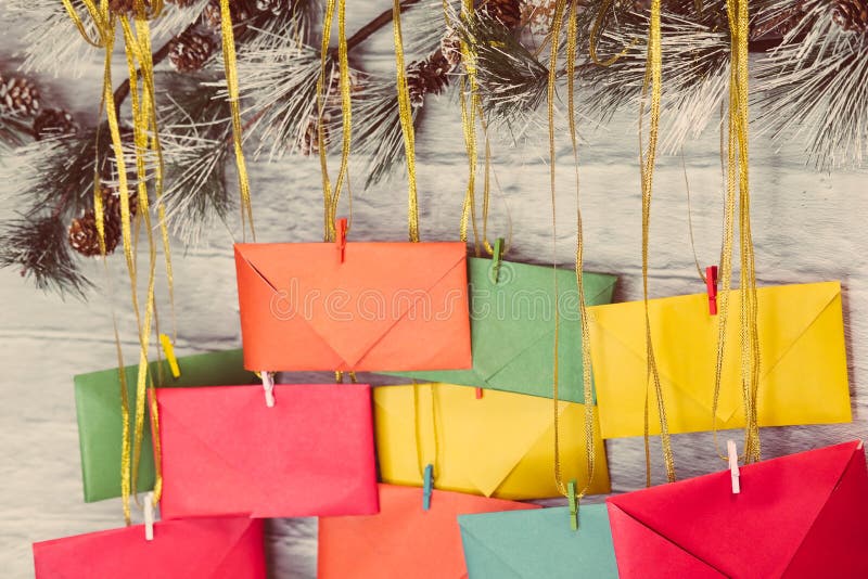 Advent Calendar on a Background of a Brick Wall. Multicolored Envelopes