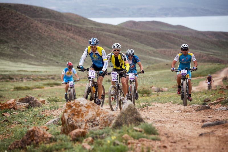 ALMATY, KAZAKSTAN - MAY 02, 2015: N.Tlegenov (N21) in action at Adventure mountain bike cross-country marathon in mountains Jeyran Trophy 2015