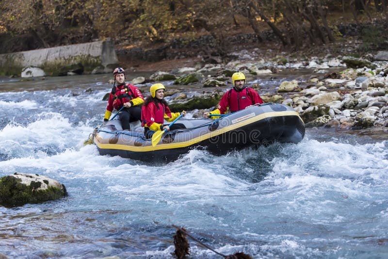 Adventurous Group Doing White Water Rafting the Rapids of River