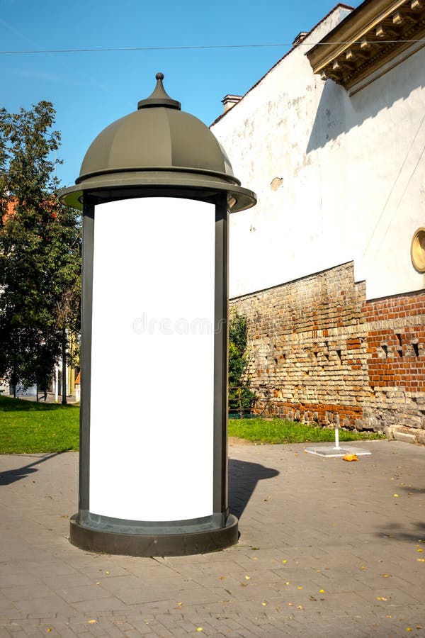 Advertising column mock up. Blank billboard outdoors, outdoor advertising, public information board in the european city