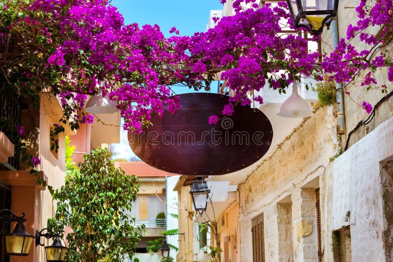 Advertising signboard on touristic street Rethymno.