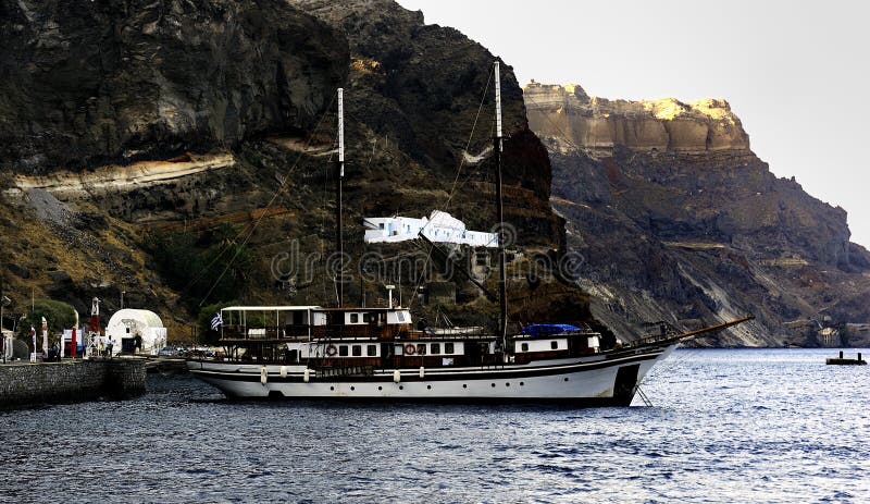 Aegeotissaic below the cliffs of Santorini stock image