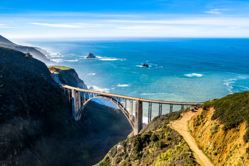 Aerial Bixby Bridge Rocky Creek Bridge and Pacific Coast Highway near Big Sur in California, USA. Drone Shot