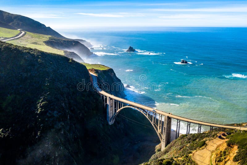 Aerial Bixby Bridge Rocky Creek Bridge and Pacific Coast Highway near Big Sur in California, USA. Drone Shot