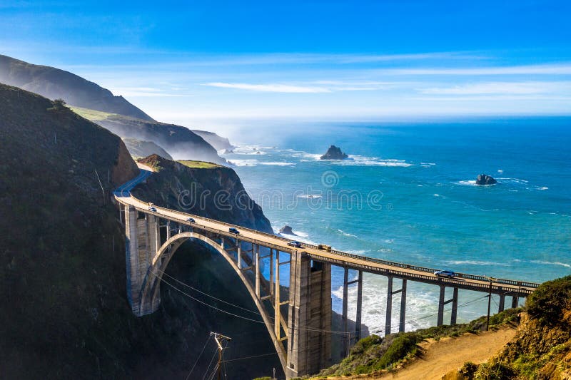 Aerial Bixby Bridge Rocky Creek Bridge and Pacific Coast Highway near Big Sur in California, USA. Drone Shot