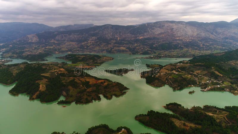 Aerial copter flight over beautiful Manavgat River surrounded by mountains in Manavgat town, Antalya Province, Turkey.