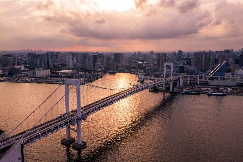 Aerial drone photo - Rainbow Bridge and the skyline of Tokyo at sunset. Capital city of Japan. royalty free stock image Aerial drone photo - Rainbow Bridge and the skyline of Tokyo at sunset. Capital city of Japan. royalty free stock image