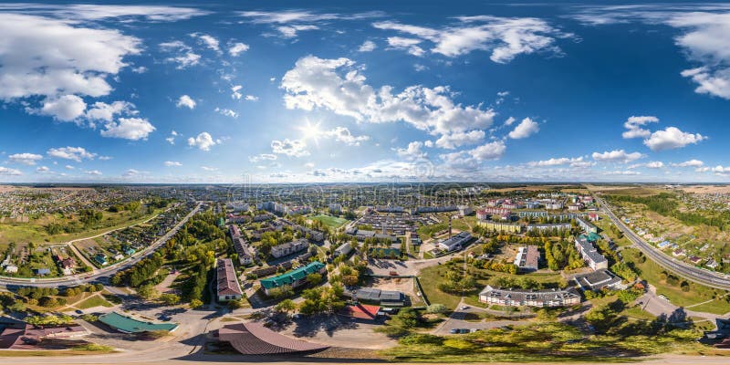 aerial full seamless spherical 360 hdri panorama view above great height of small provincial town with private sector and high-rise apartment buildings in equirectangular projection.