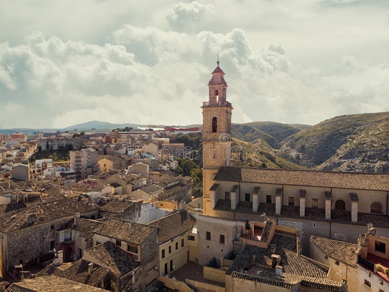 Aerial image ancient architecture view of Bocairent against hills and cloudy sky background royalty free stock photo
