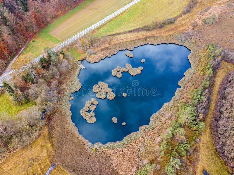 Aerial image of a pond with floating turf mats stock photos