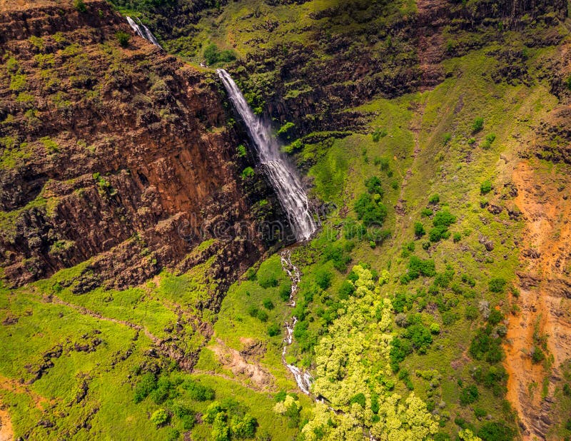 Aerial landscape view of waterfall and green landscape, Kauai stock images Aerial landscape view of waterfall and green landscape, Kauai stock images