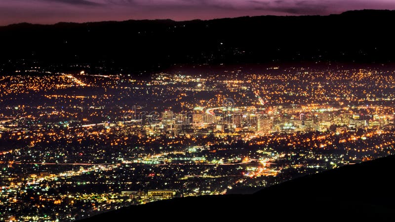 Aerial night view of the brightly illuminated downtown area of San Jose, Silicon Valley, California