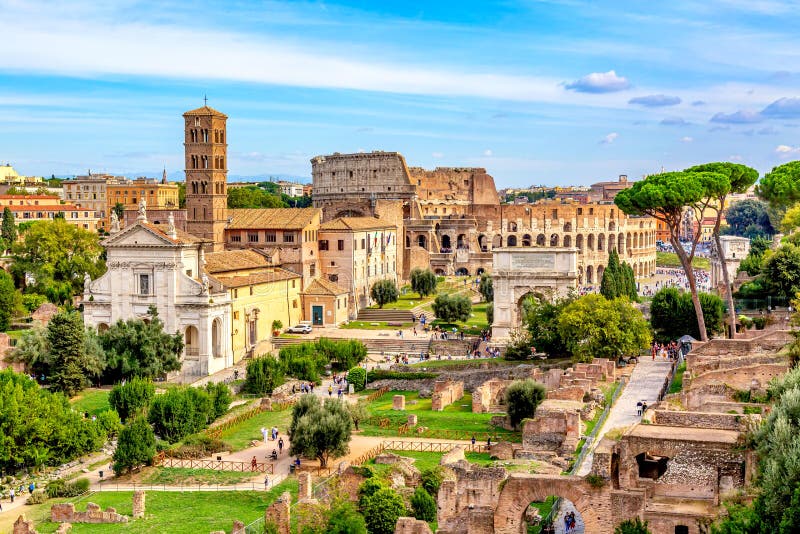 Aerial panoramic cityscape view of the Roman Forum and Roman Colosseum in Rome, Italy. World famous landmarks in Italy during