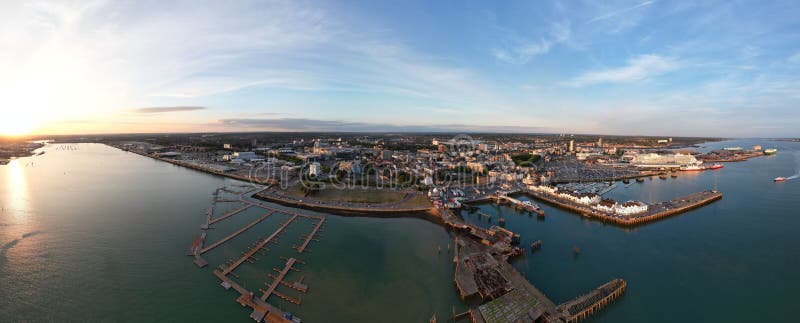 Aerial panoramic shot of a port with Southampton&x27;s buildings in the background, England