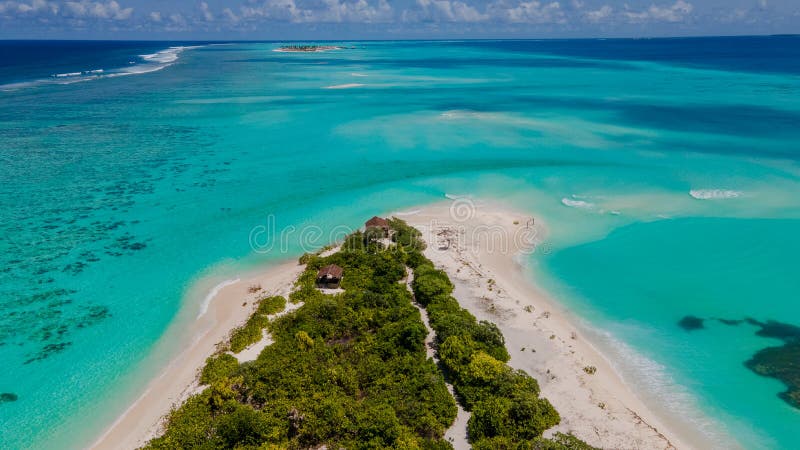 Aerial photo of the amazing beautiful tropical island Fenfushi with beach in lagoon at the indian ocean