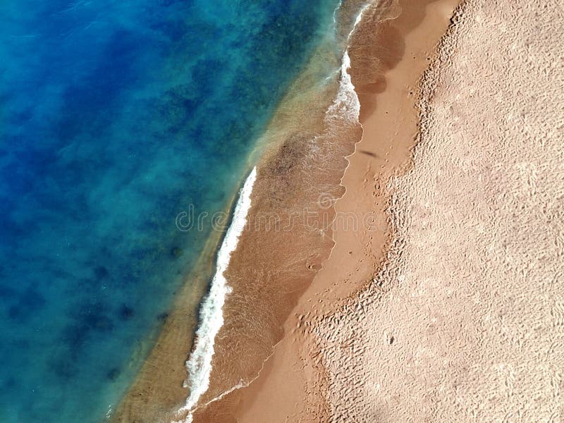Aerial Photo Of A Pristine Exotic Sandy Beach Near a Blue Seaside stock photo Aerial Photo Of A Pristine Exotic Sandy Beach Near a Blue Seaside stock photo