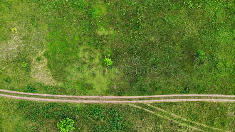 Aerial. Road through the Rugged Terrain. Green Meadow Stock Photo - of green, trail: 223905926