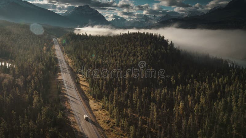 Aerial of rv driving on icefields parkway in jasper birds eye