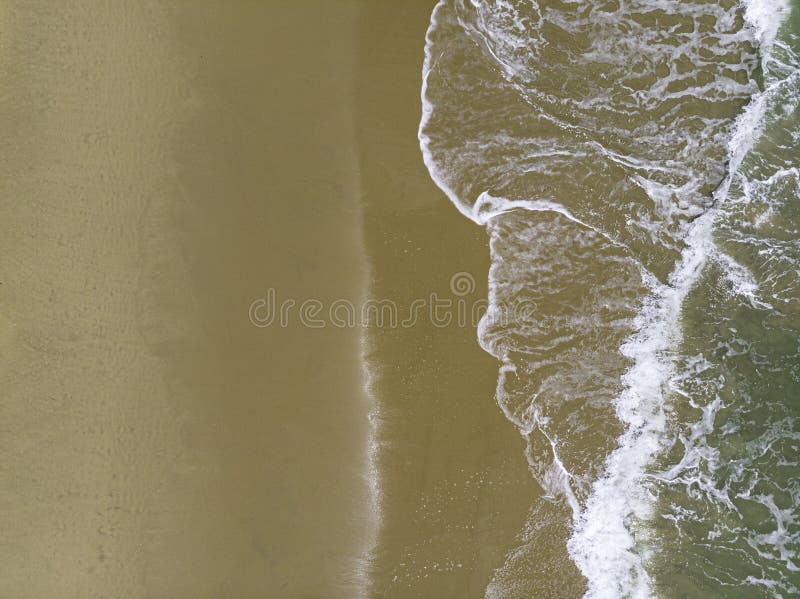 Aerial shot of the couple on the white sand beach in Thailand