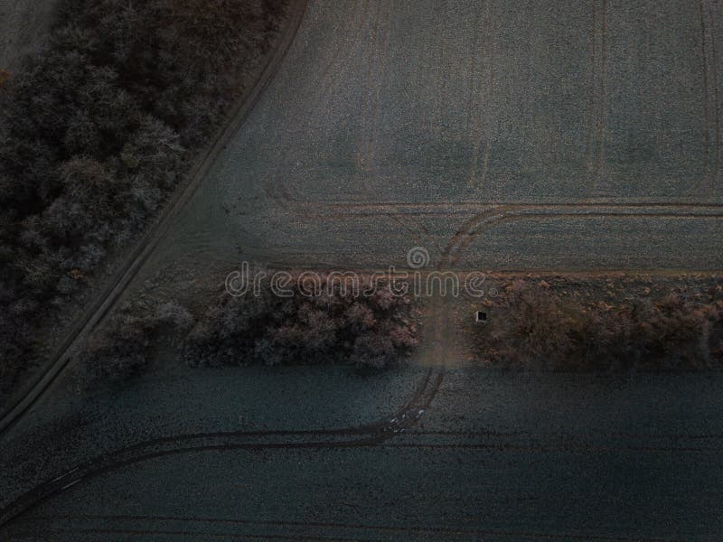 Aerial shot of a farm field with tracks royalty free stock photography