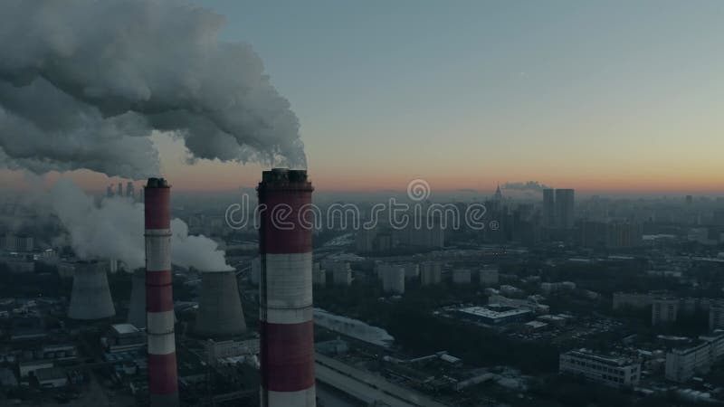 Aerial view of industrial smoke stacks within cityscape of Moscow in the winter morning, Russia