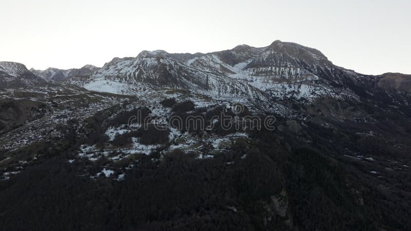 Aerial - Majestic snowy mountain range of Ibon de los Banos in the Pyrenees, Huesca, Spain, showcasing its natural stock video