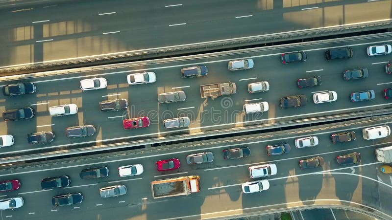 Aerial top down descending shot of a traffic jam on a city highway in the rush hour