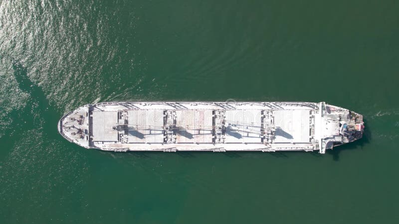 Aerial top down view of rdry cargo ship floats. Ship logistic and transportation business industry.