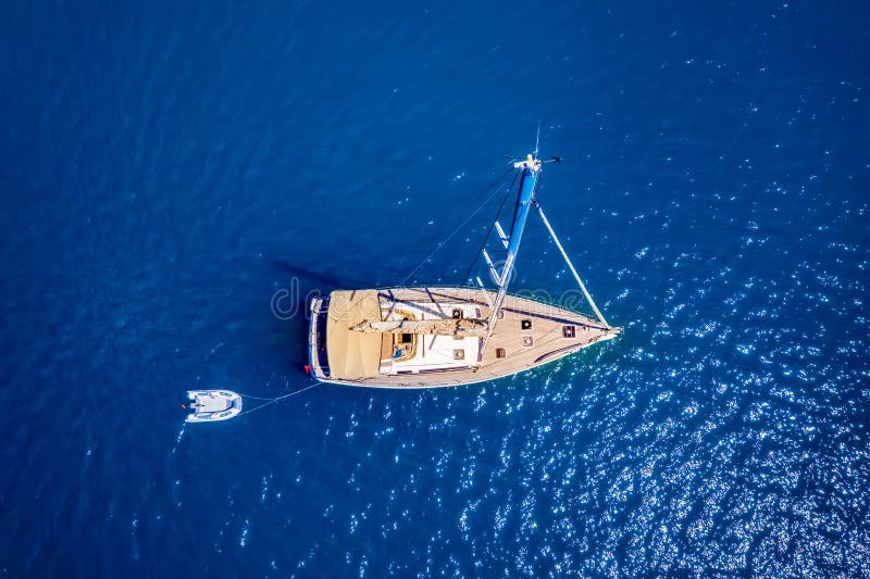 Aerial top down view of a sailing boat