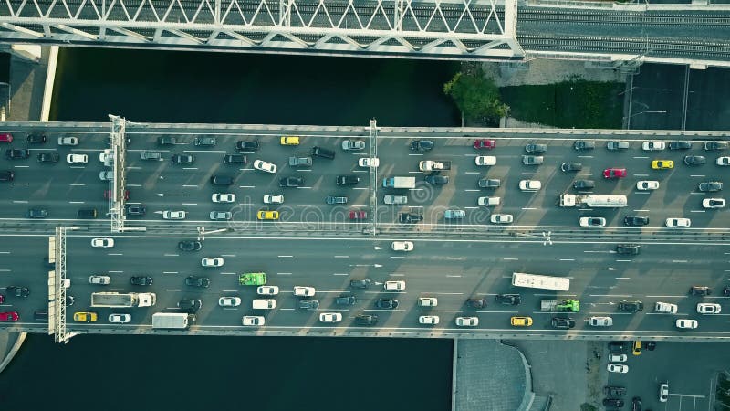 Traffic jam on a car bridge and moving train