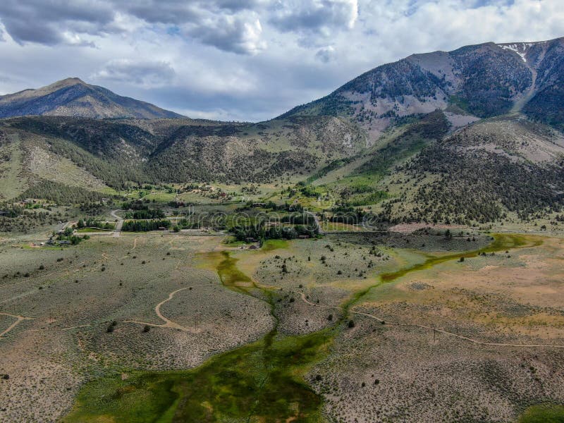 Aerial Top View of Green Land and Mountain in the Background Stock ...