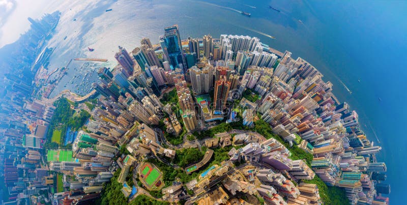 Aerial top view of Hong Kong Downtown, republic of china. Financial district and business centers in smart urban city in Asia.