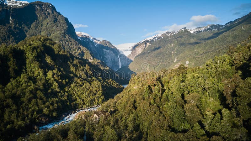 Aerial of Ventisquero Colgante, a hanging Glacier with waterfall and lake in queulat national park