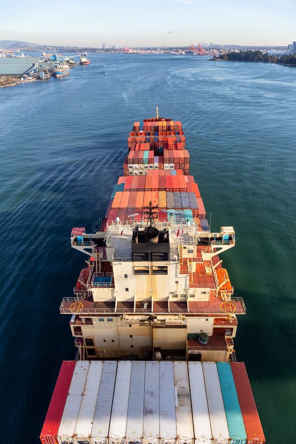 Aerial View from Above of a Cargo Ship arriving to the Port