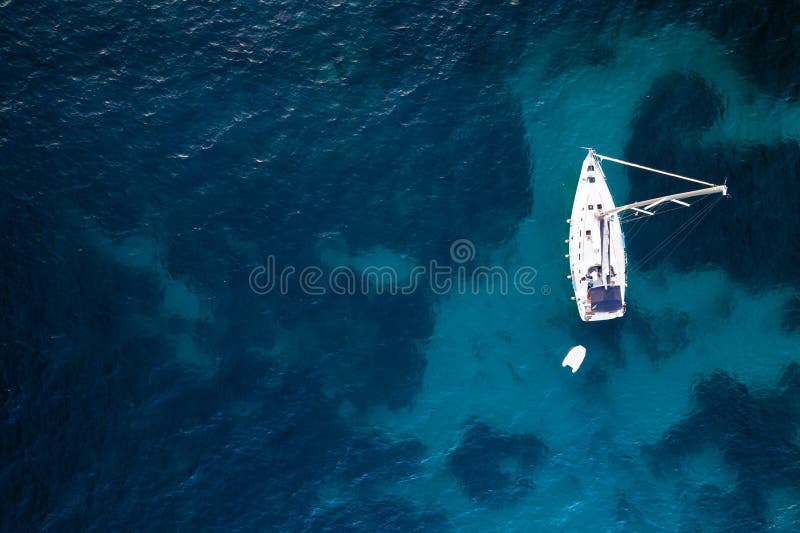 Aerial view of anchored sailing yacht