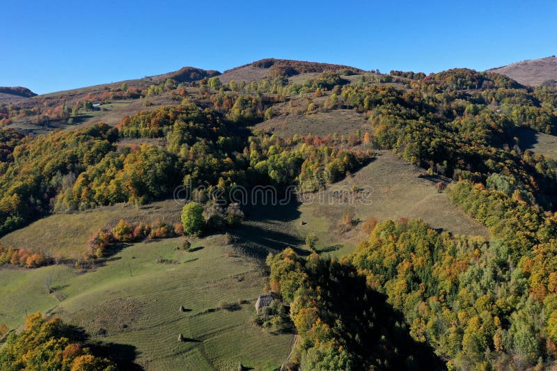 Aerial view of autumn hills and colorful forest stock photos