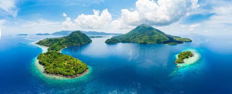 Aerial view Banda Islands Moluccas archipelago Indonesia, Pulau Gunung Api, lava flows, coral reef white sand beach. Top travel
