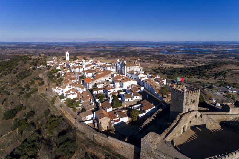 Aerial view of the beautiful village of Monsaraz, with the Alqueva dam on the background, in Alentejo