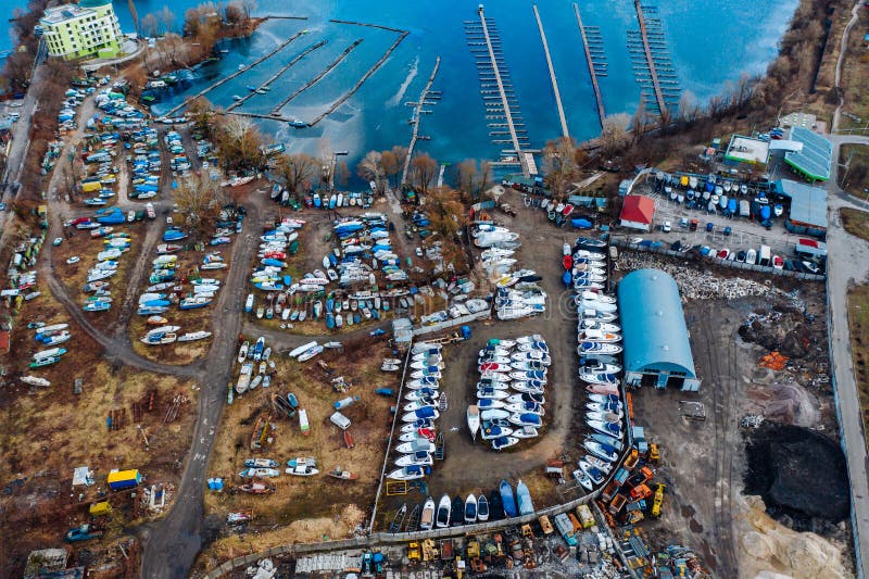 Aerial view of boat yard on land. Stored ships during winter time