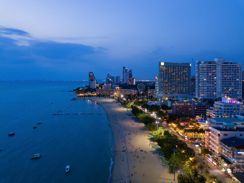 Aerial View Of Boats In Pattaya Sea Beach At Night And Urban City