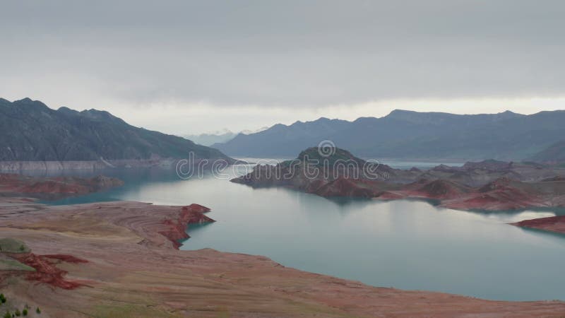 Aerial of view breathtaking landscape with an island with rocky shores exposed due to the small water level in the lake