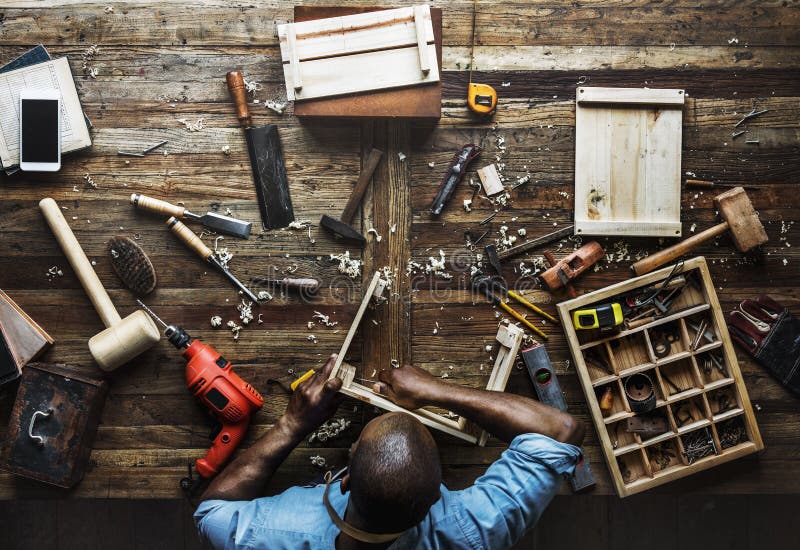 Aerial view of carpenter man working with tools equipment set