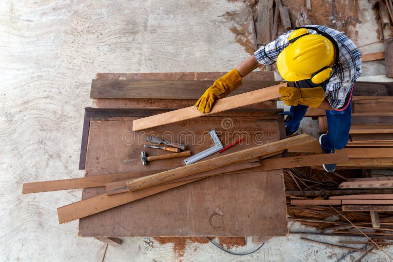Aerial View of Carpenter Working in Construction Site Stock Photo