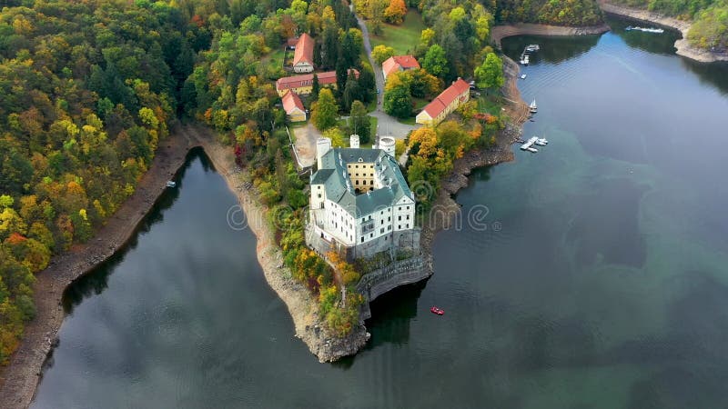 Aerial view chateau Orlik, above Orlik reservoir in beautiful autumn nature. Romantic royal Schwarzenberg castle above water level