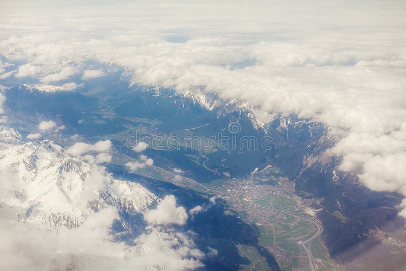 Aerial view of clouds and village landscape. Earth from airplane