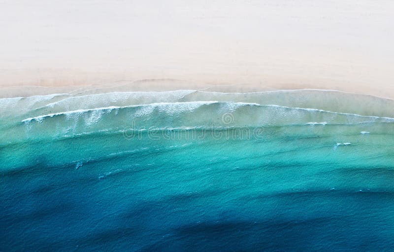 Aerial view on the coast line. Beach and sea from air as a background. Summer seascape from drone.