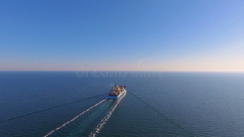 Aerial view of container ship floats in the ocean after loading in port of China