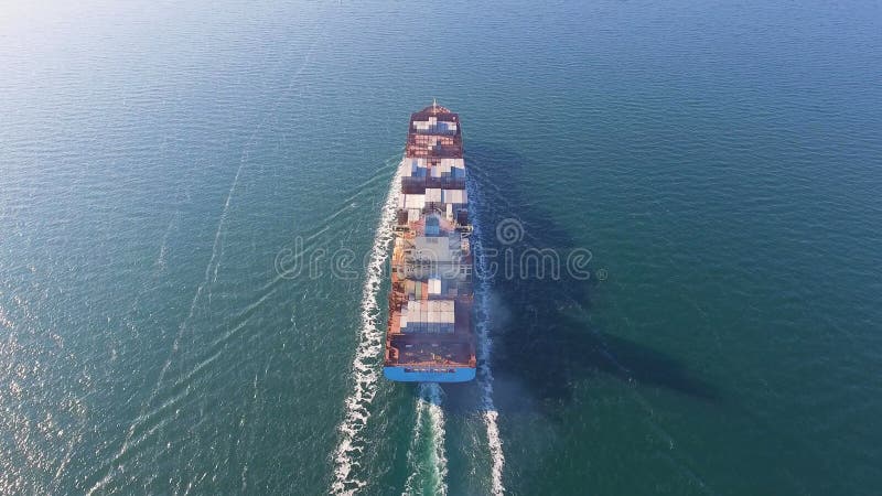 Aerial view of container ship floats in the ocean after loading in port of China