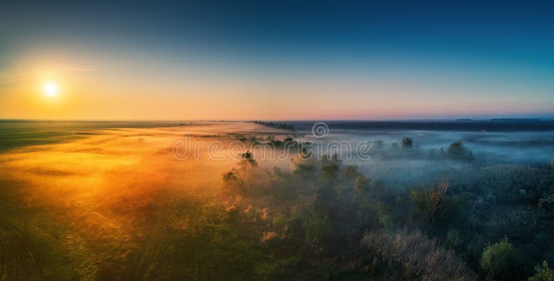 Aerial view of highway with forest and fields in fog royalty free stock photos Aerial view of highway with forest and fields in fog royalty free stock photos